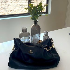 Kate spade black leather bag with light gold chain strap.